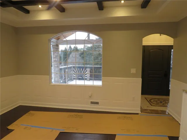 a view of a hallway with seating area