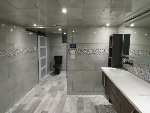 a bathroom with a sink and a mirror
