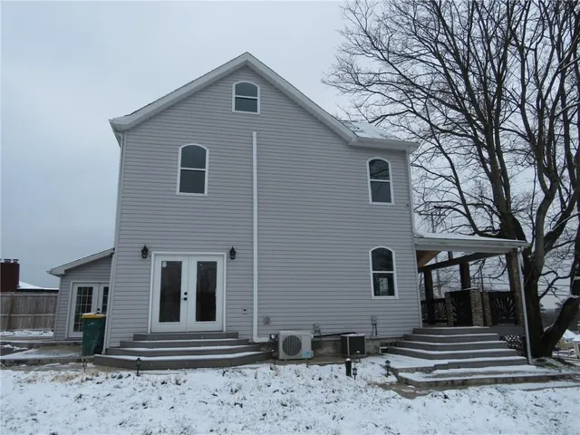 a front view of a house with stairs