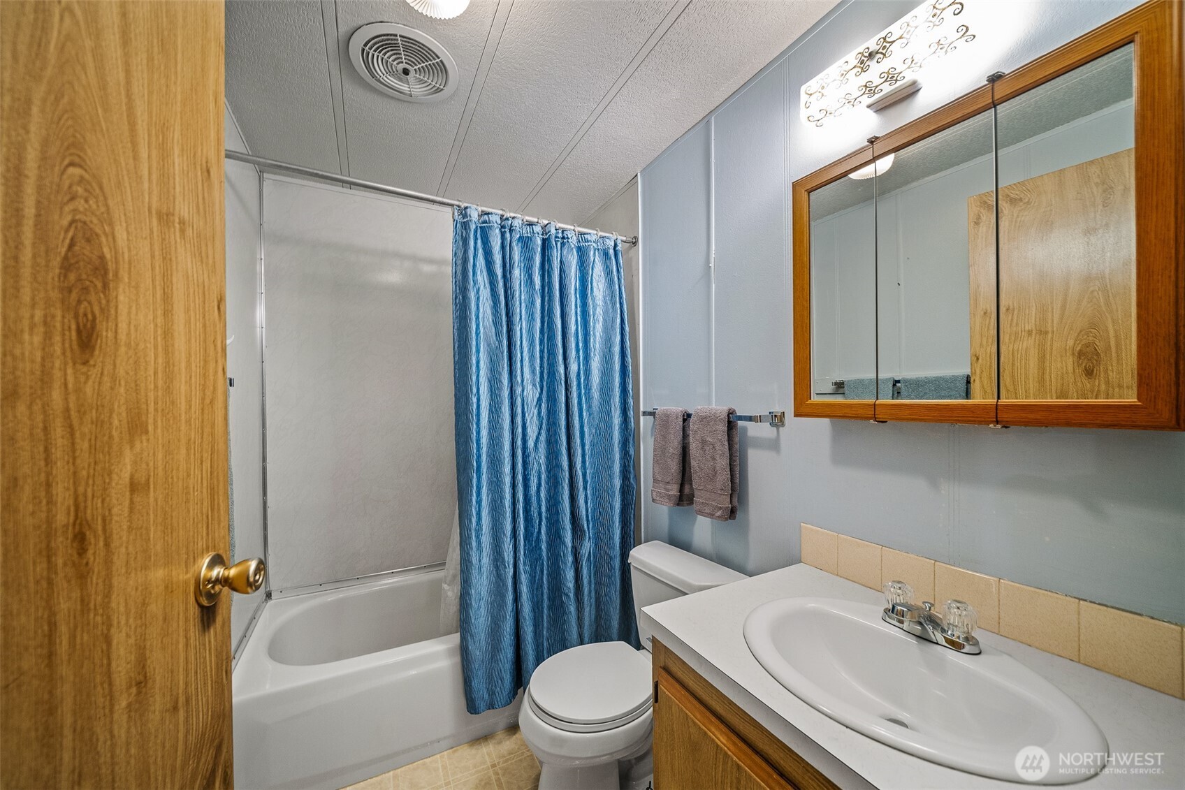 930 Trosper Road Southwest, Unit 43 Tumwater, WA 98512 - Photo 11 of 26 a bathroom with a sink toilet and shower