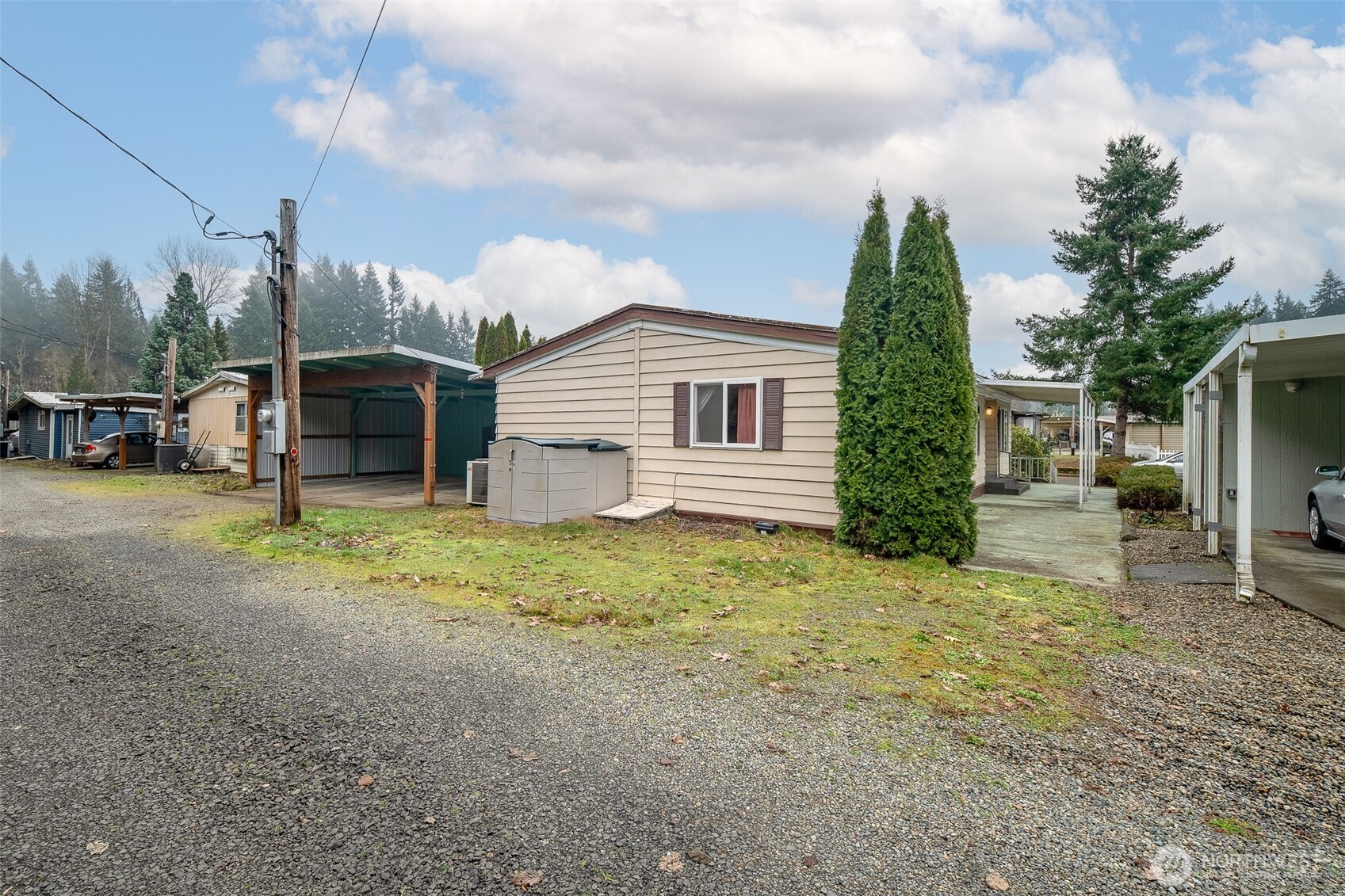 930 Trosper Road Southwest, Unit 43 Tumwater, WA 98512 - Photo 23 of 26 a view of a house with a yard and sitting area