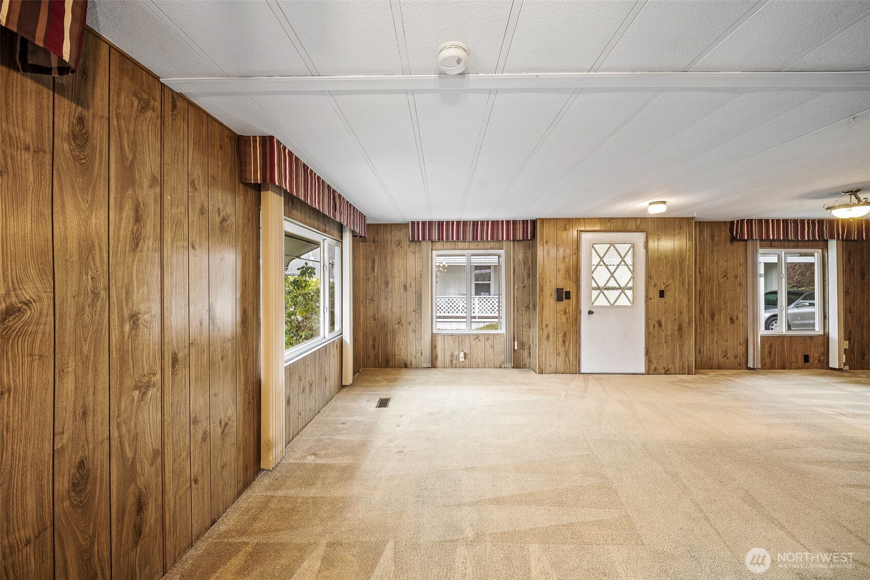 930 Trosper Road Southwest, Unit 43 Tumwater, WA 98512 - Photo 4 of 26 a view of an empty room with closet and a window