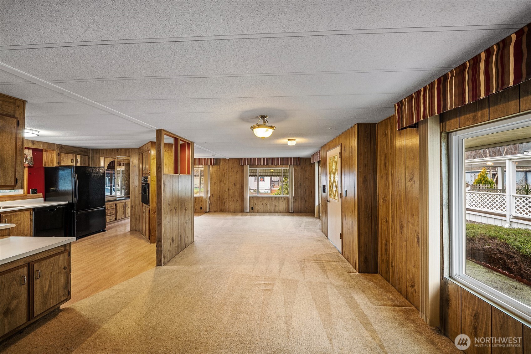 930 Trosper Road Southwest, Unit 43 Tumwater, WA 98512 - Photo 6 of 26 a view of a hallway with wooden shelves