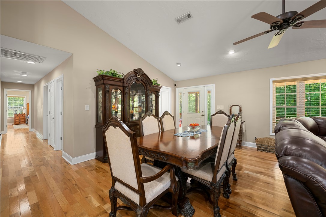 304 West A 144 Walhalla, SC 29691 - Photo 13 of 43 This inviting dining area features natural light, a vaulted ceiling, and gleaming hardwood floors.