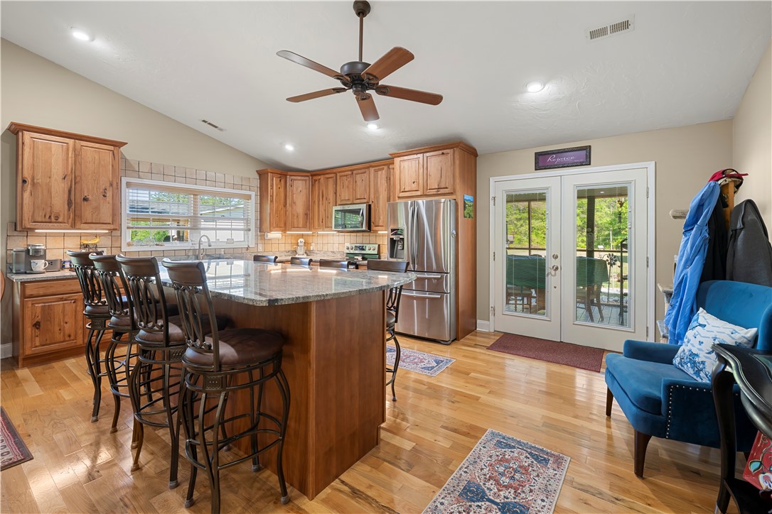 304 West A 144 Walhalla, SC 29691 - Photo 19 of 43 This spacious kitchen offers a large island with seating, ample cabinetry, and direct outdoor access.