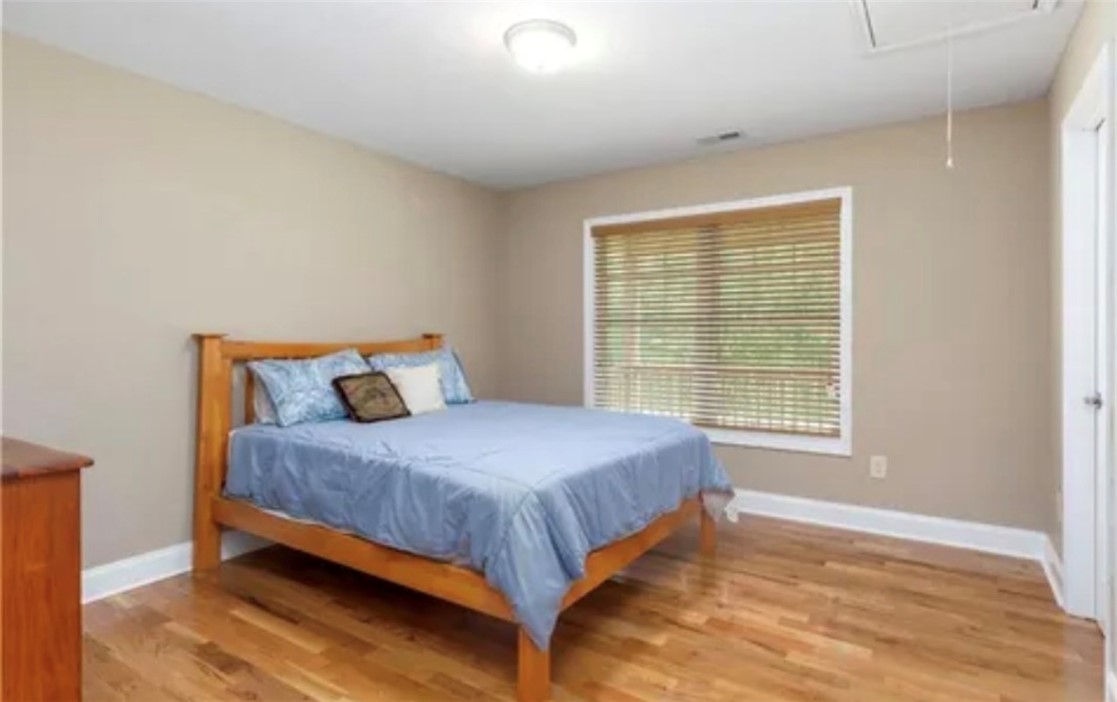 304 West A 144 Walhalla, SC 29691 - Photo 22 of 43 This bright room features beautiful wood flooring and a window with natural light.