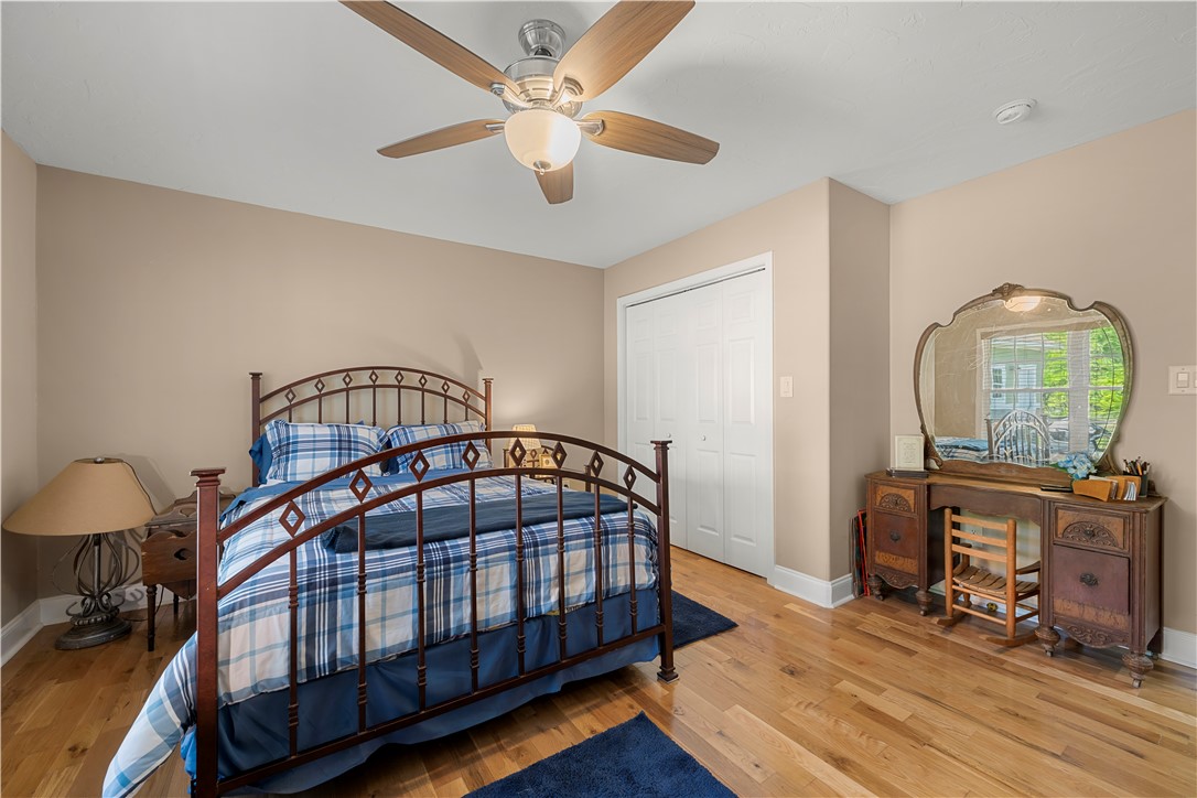 304 West A 144 Walhalla, SC 29691 - Photo 26 of 43 This spacious bedroom features warm wood flooring and ample closet space, creating a comfortable living area.