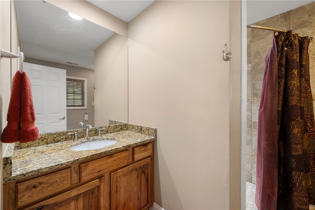 304 West A 144 Walhalla, SC 29691 - Photo 27 of 43 This clean bathroom offers a spacious vanity with elegant granite countertops.