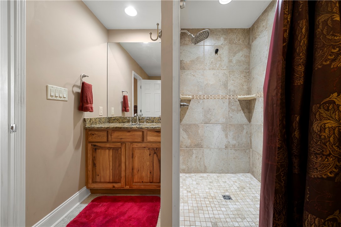 304 West A 144 Walhalla, SC 29691 - Photo 28 of 43 This bathroom features a sleek vanity with ample storage and a spacious walk-in shower.