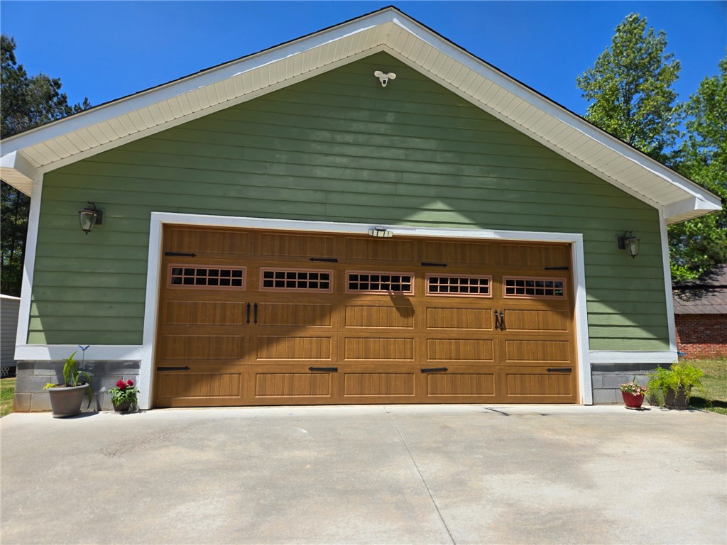 304 West A 144 Walhalla, SC 29691 - Photo 37 of 43 This spacious garage features a classic wooden door, providing ample storage and convenience.