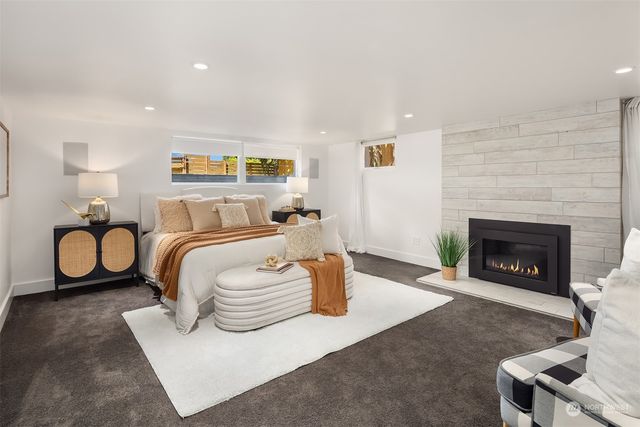 a bedroom with furniture and a potted plant