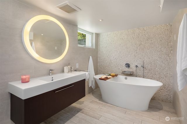 a view of storage and utility room with wooden floor