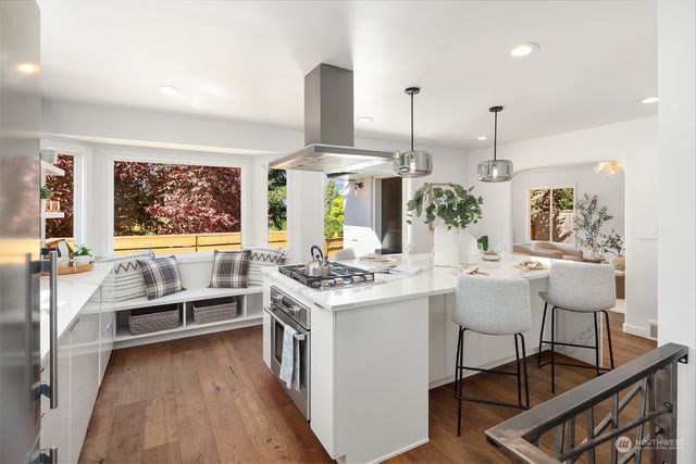a kitchen with a table and chairs