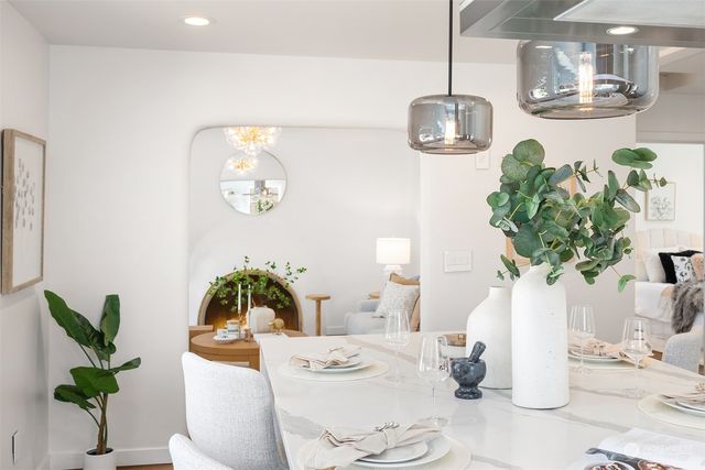 a kitchen with stainless steel appliances kitchen island granite countertop a sink and cabinets