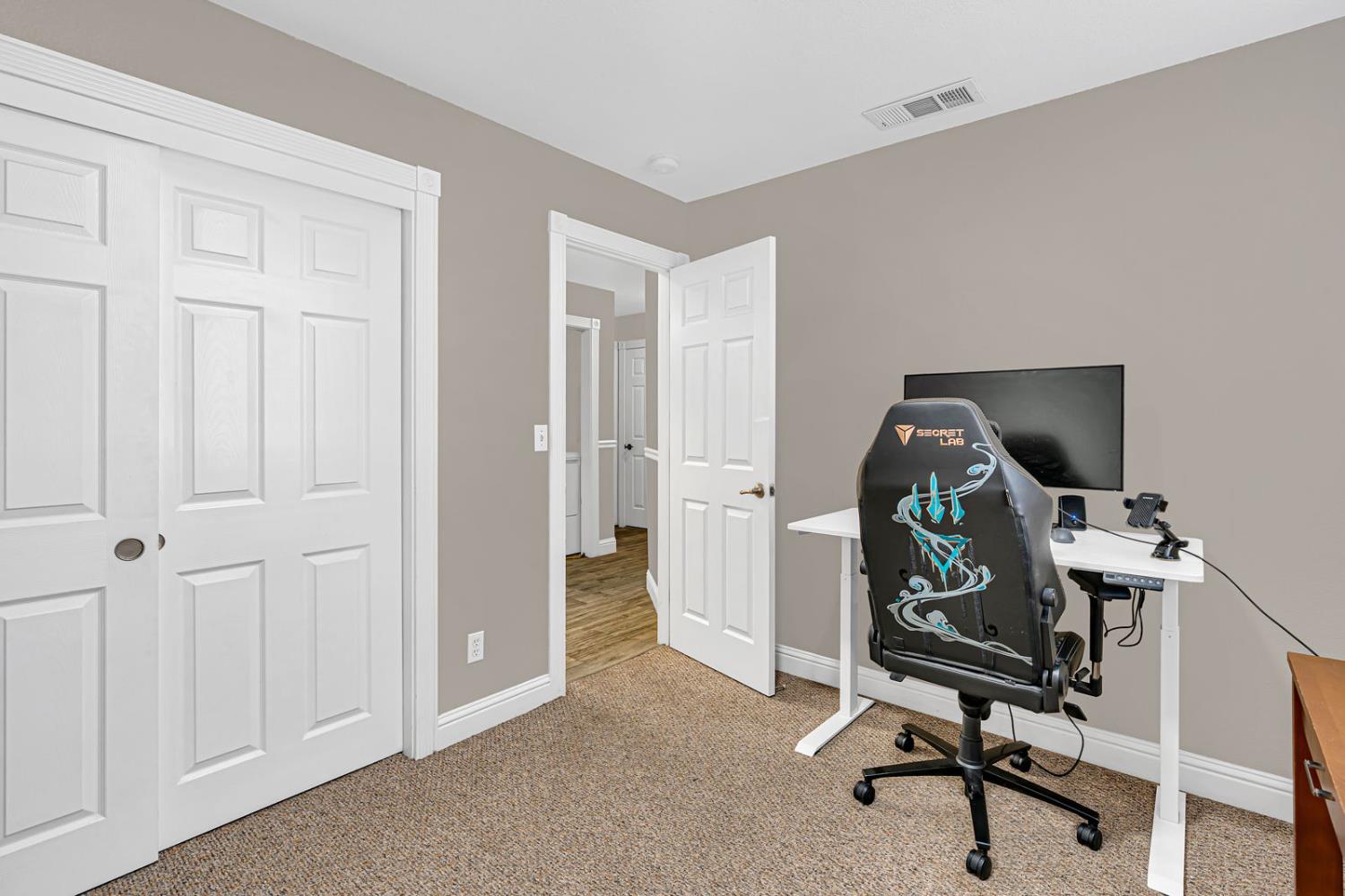 1406 San Rafael Street Los Banos, CA 93635 - Photo 19 of 35 a view of a workspace with furniture and a window