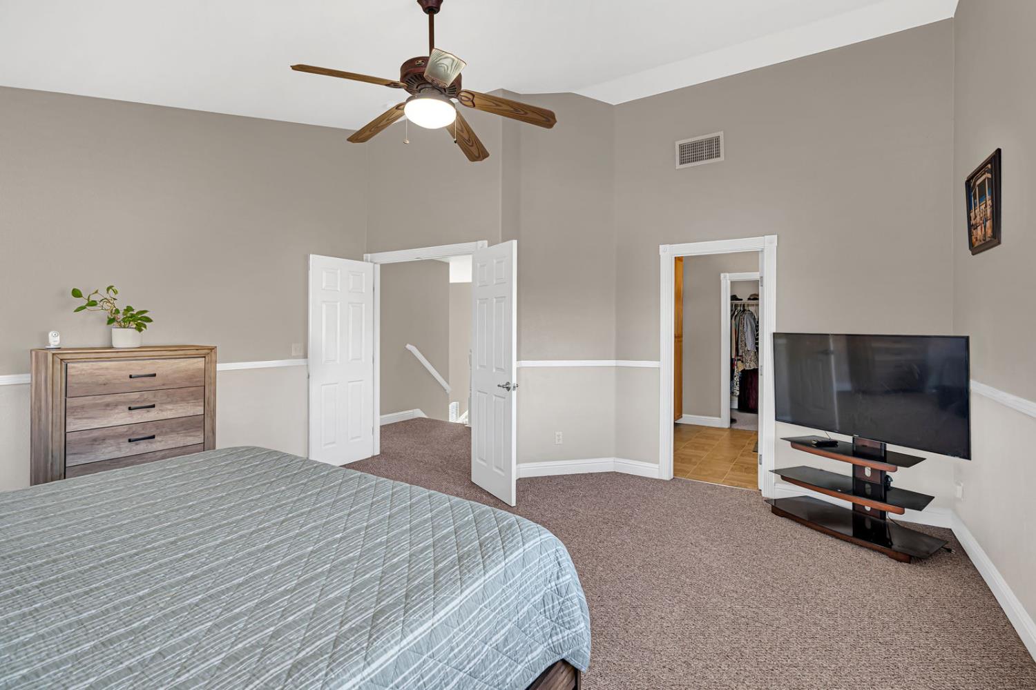 1406 San Rafael Street Los Banos, CA 93635 - Photo 23 of 35 a bedroom with a bed and a flat screen tv