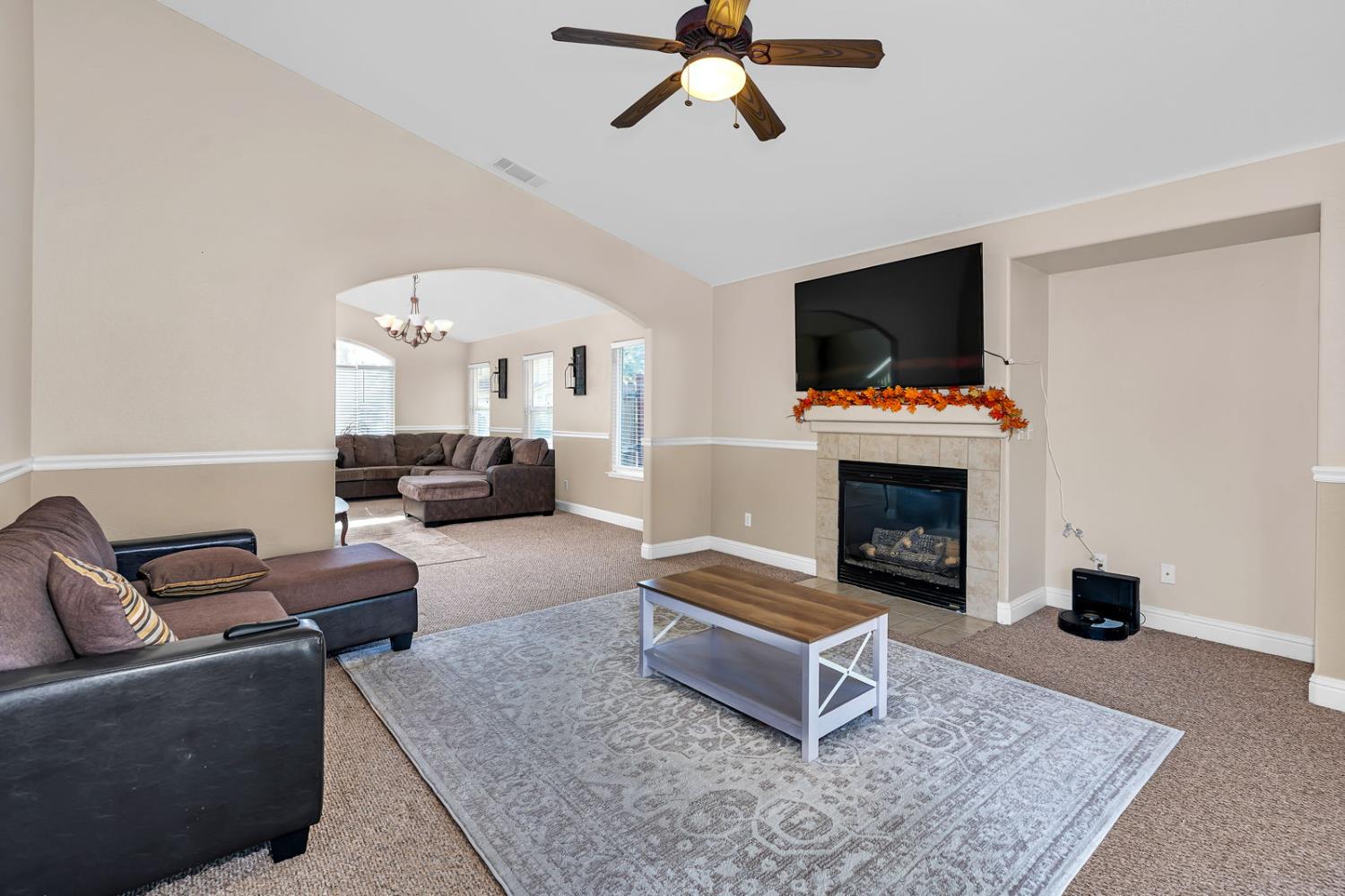 1406 San Rafael Street Los Banos, CA 93635 - Photo 9 of 35 a living room with furniture and a fireplace
