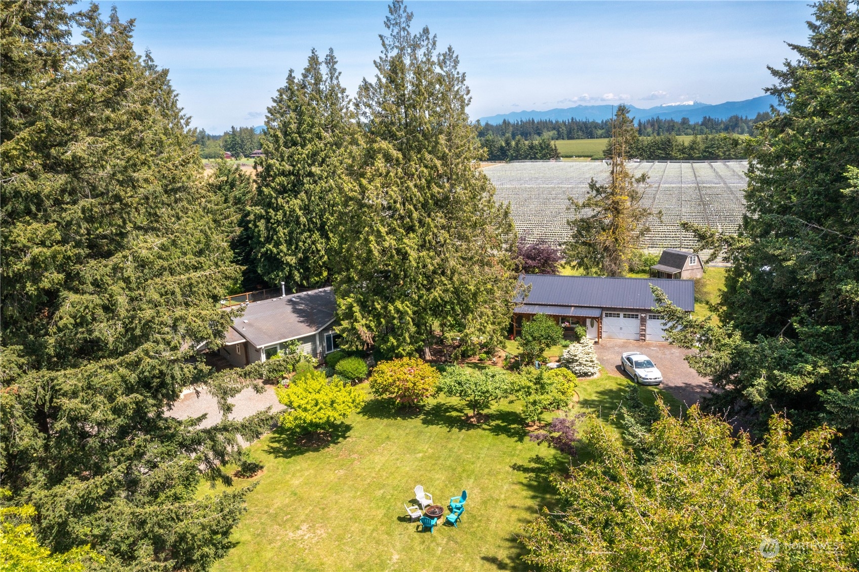 8338 Bob Hall Road Lynden, WA 98264 - Photo 1 of 37 a view of a lake with a house in the background