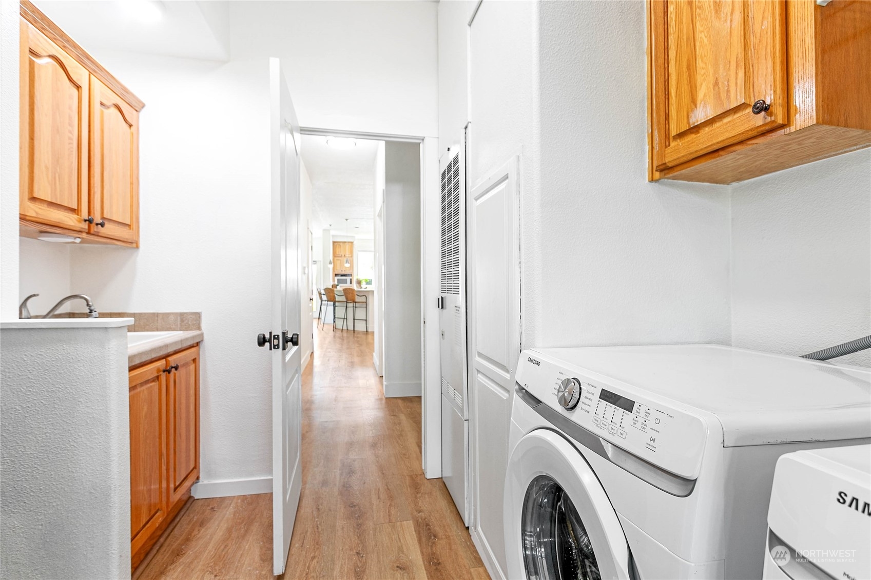 8338 Bob Hall Road Lynden, WA 98264 - Photo 19 of 37 a view of a hallway with washer and dryer
