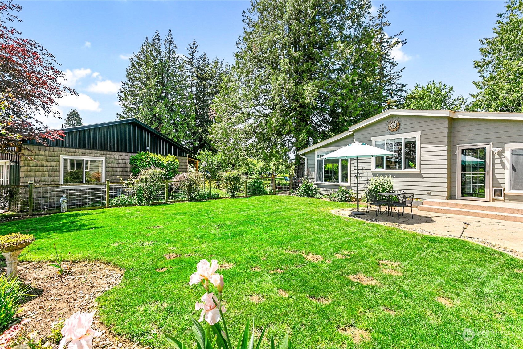 8338 Bob Hall Road Lynden, WA 98264 - Photo 2 of 37 a front view of house with yard and green space