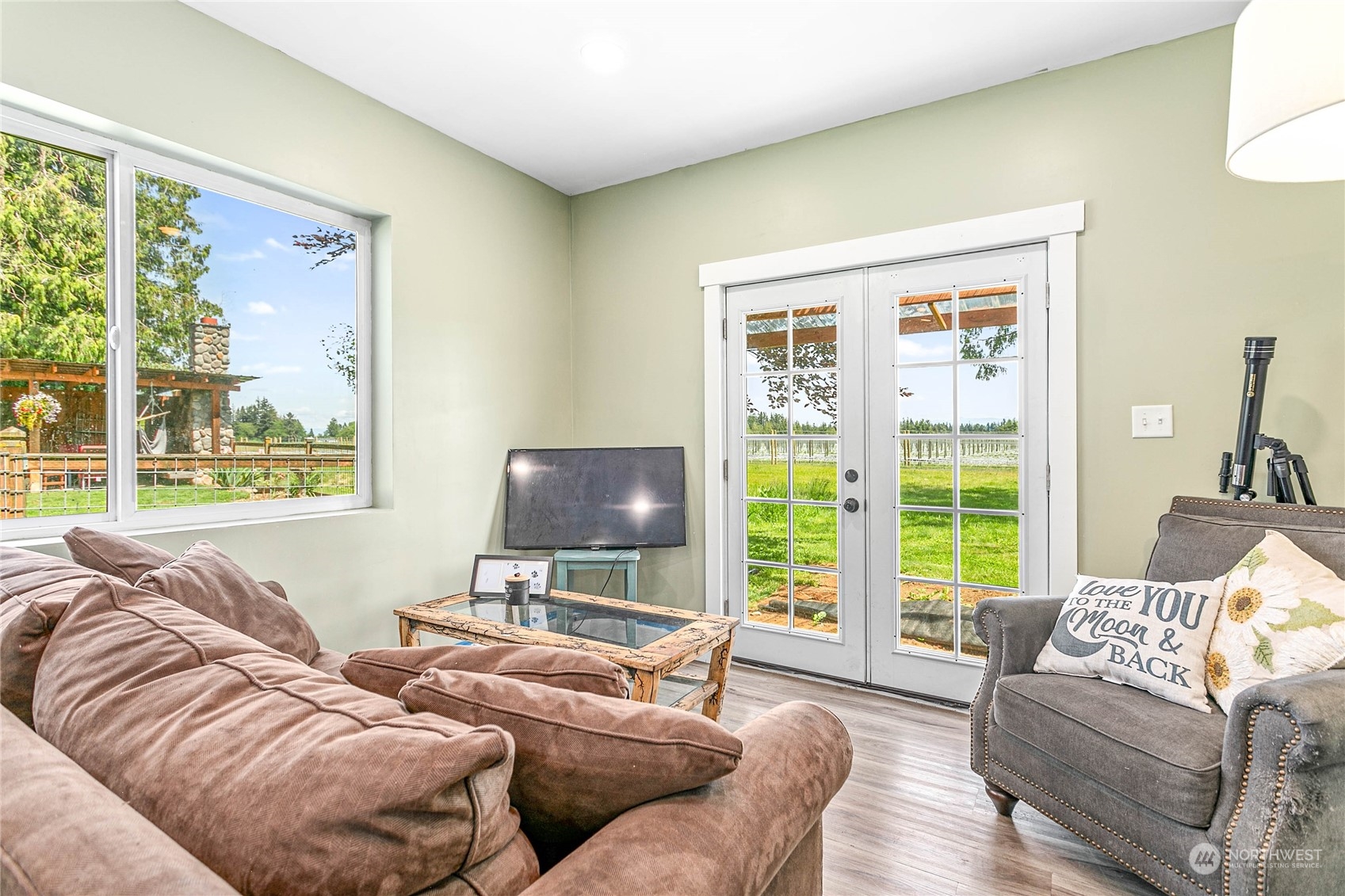 8338 Bob Hall Road Lynden, WA 98264 - Photo 22 of 37 a living room with furniture and a flat screen tv