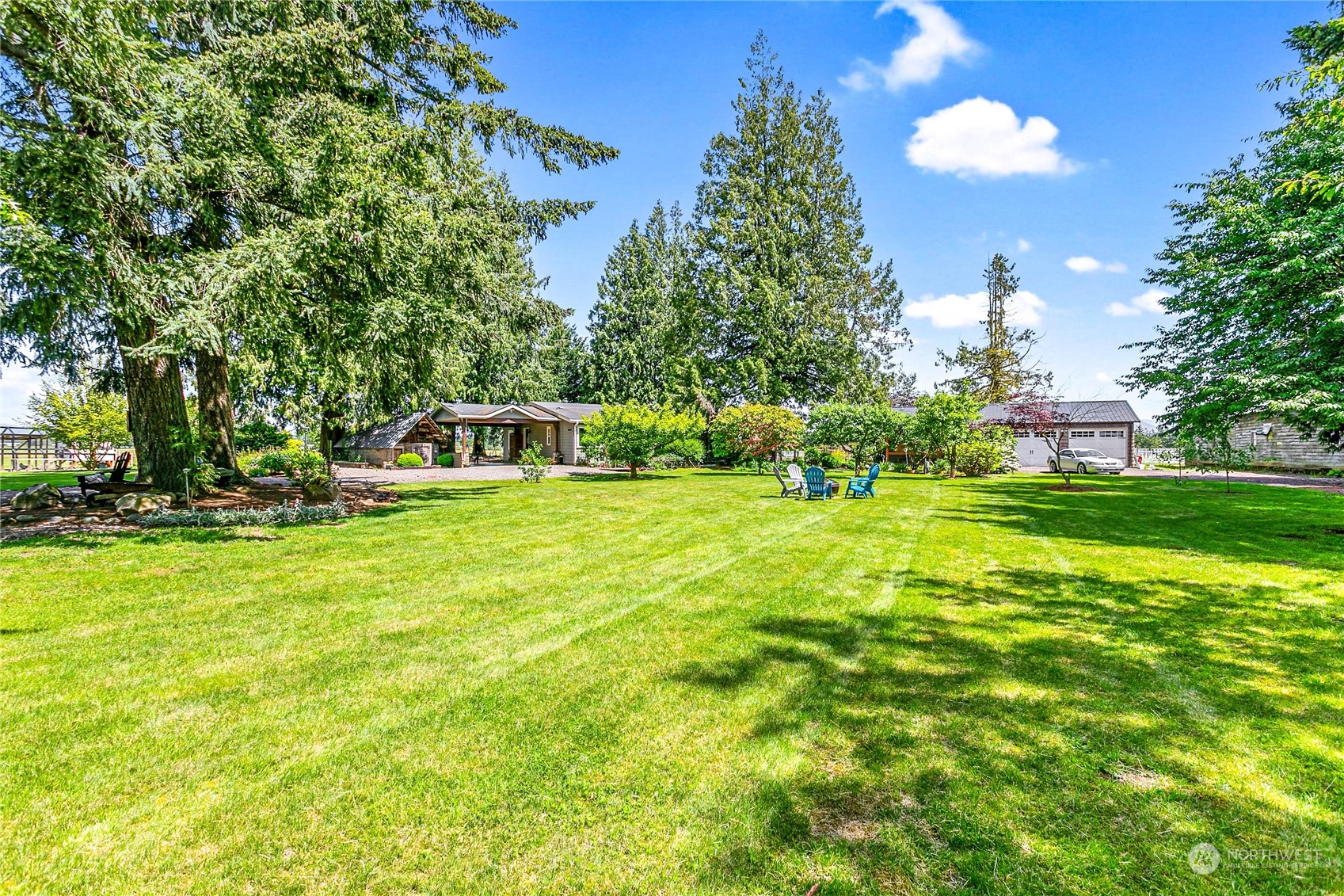 8338 Bob Hall Road Lynden, WA 98264 - Photo 28 of 37 a front view of a house with garden and trees