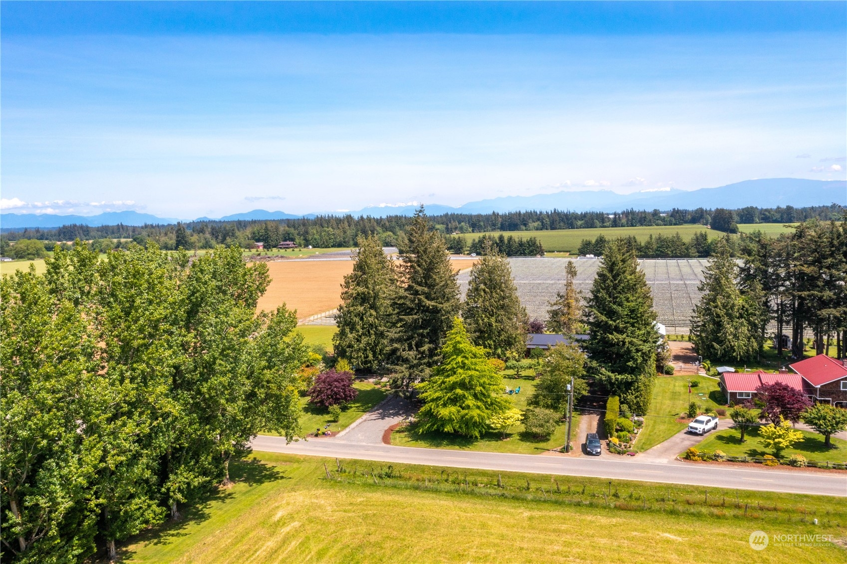 8338 Bob Hall Road Lynden, WA 98264 - Photo 34 of 37 a view of a swimming pool and lake view