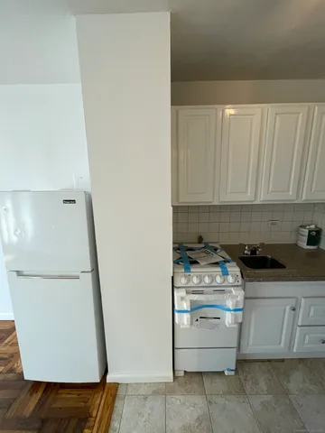a kitchen with a stove and a microwave