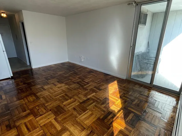 a bedroom with a bed and a mirror