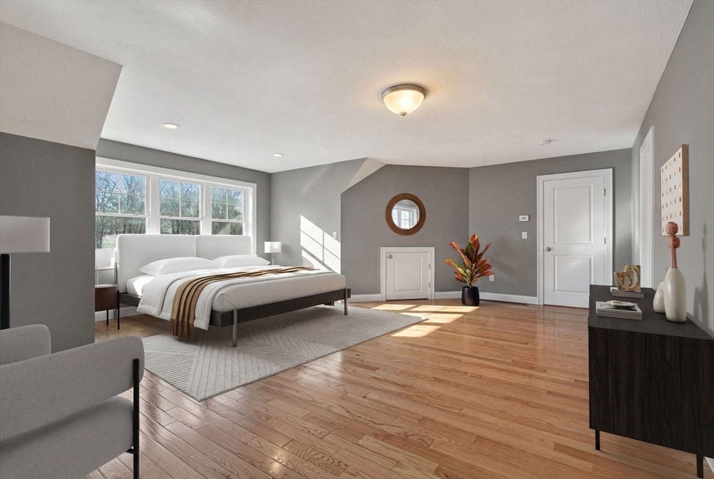 129 Acton Street, Unit 16 Maynard, MA 01754 - Photo 16 of 41 a bedroom with a bed and window