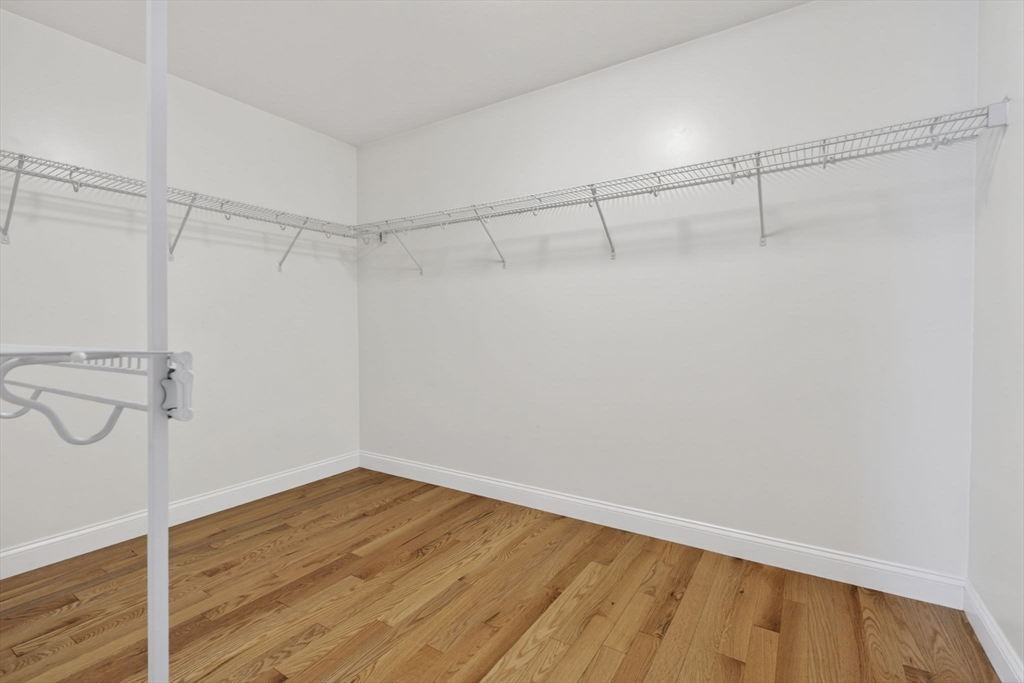 129 Acton Street, Unit 16 Maynard, MA 01754 - Photo 29 of 41 a view of a room with wooden floor