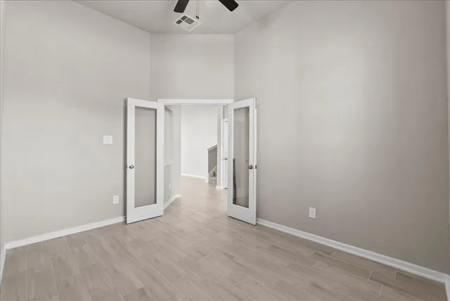 a view of a room with wooden floor