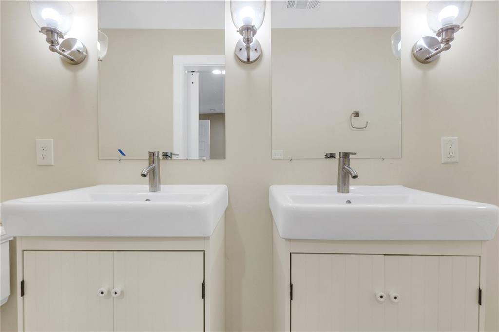 998 Mayson Turner Road Northwest, Unit A Atlanta, GA 30314 - Photo 16 of 26 a bathroom with a sink and a mirror
