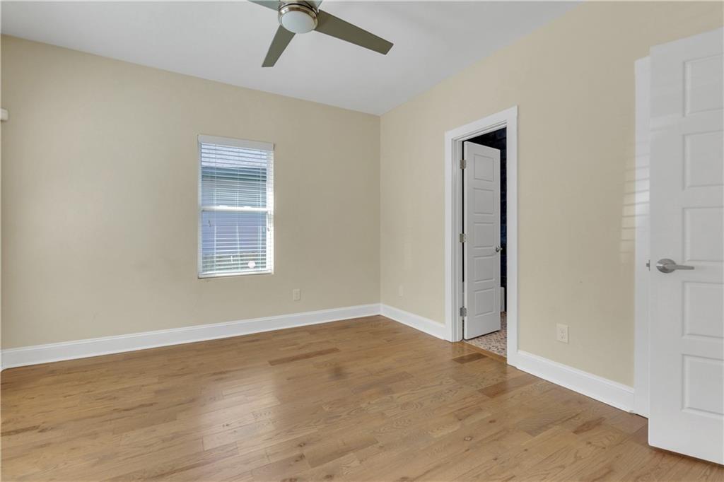 998 Mayson Turner Road Northwest, Unit A Atlanta, GA 30314 - Photo 18 of 26 an empty room with a empty space and windows