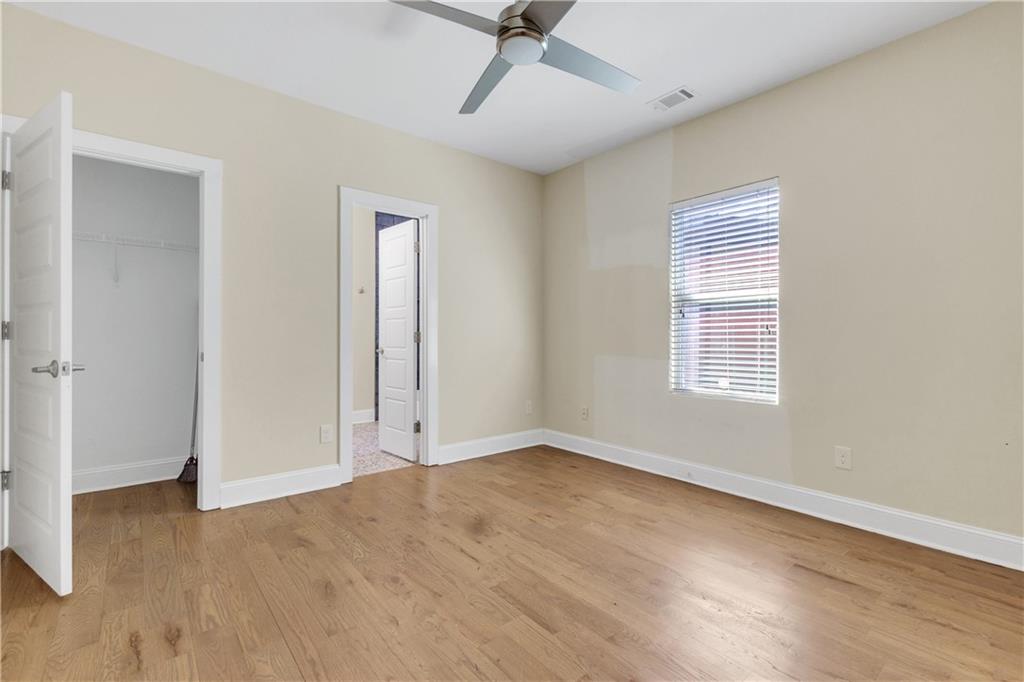 998 Mayson Turner Road Northwest, Unit A Atlanta, GA 30314 - Photo 21 of 26 wooden floor in an empty room with a window