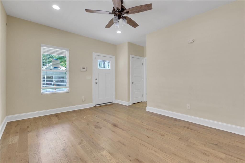 998 Mayson Turner Road Northwest, Unit A Atlanta, GA 30314 - Photo 8 of 26 wooden floor in an empty room with a window