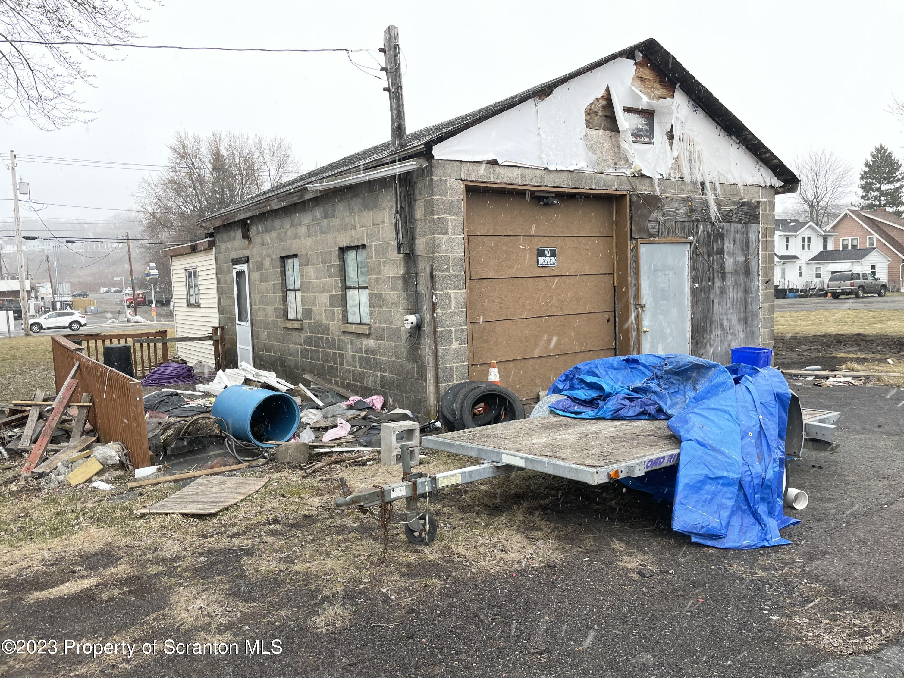 229 Main Street Archbald, PA 18403 - Photo 8 of 13 a view of a two chairs in the back yard of the house