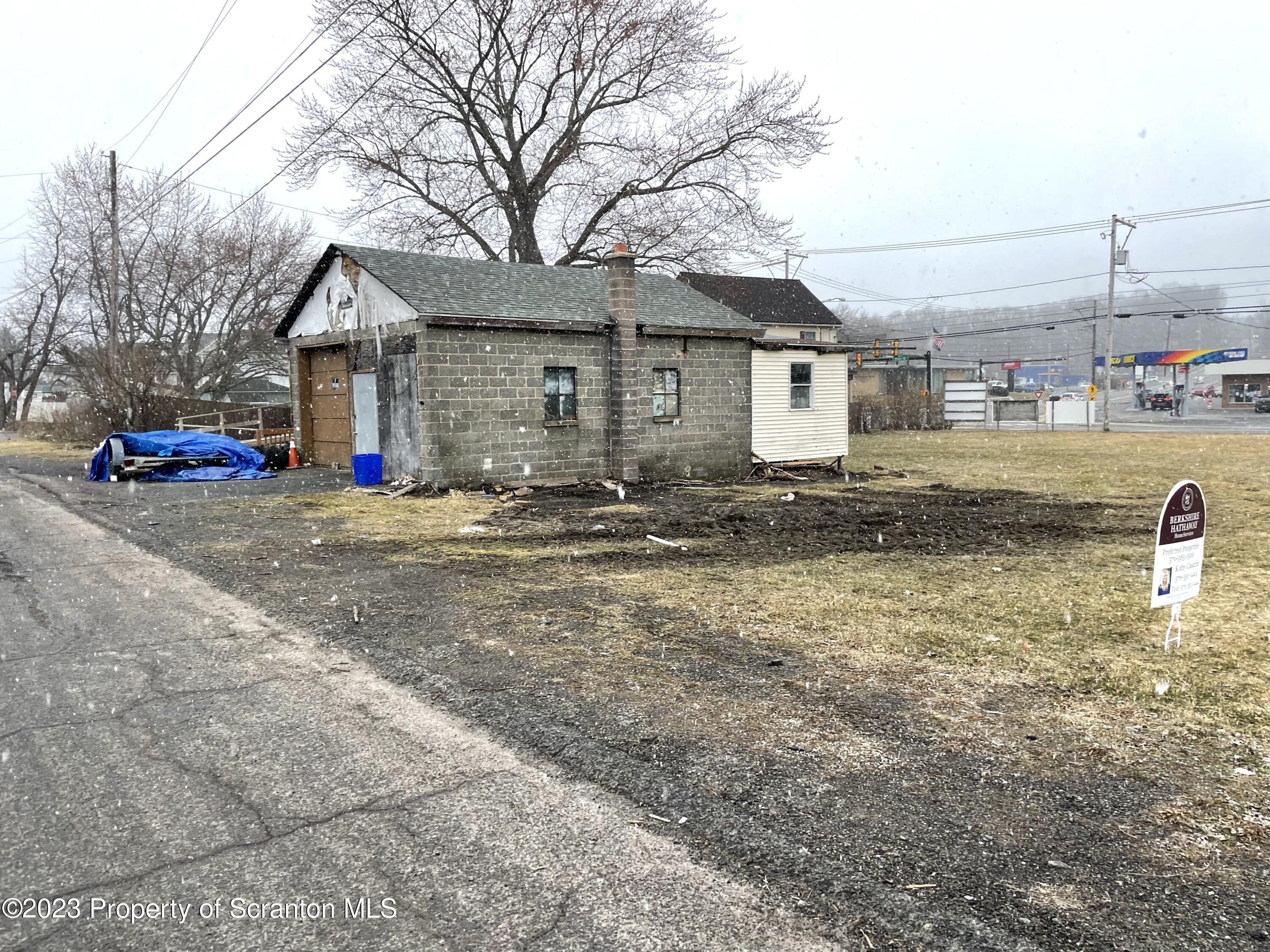 229 Main Street Archbald, PA 18403 - Photo 10 of 13 a view of a house with a yard covered in the road