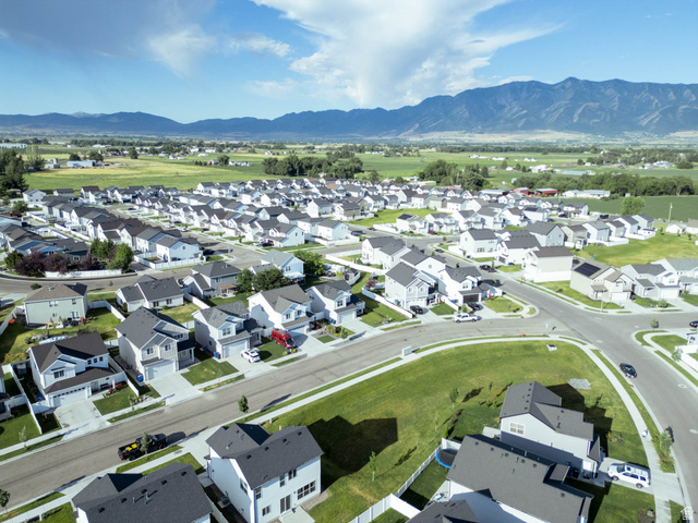 1486 West 2055th Street South Logan, UT 84339 - Photo 43 of 45 Expansive residential development featuring contemporary homes with dark shingle roofs, light-colored siding, and attached garages