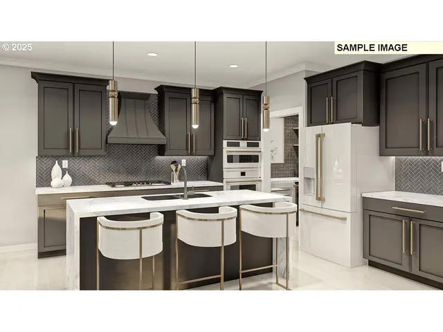 a kitchen with a sink a refrigerator and chairs