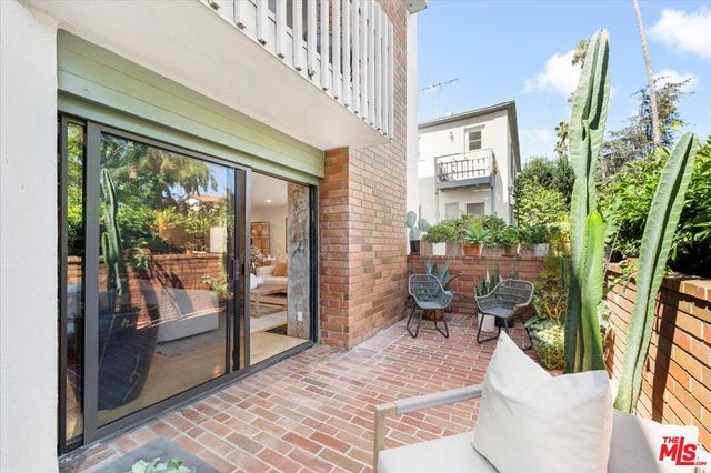 a view of a living room and a patio