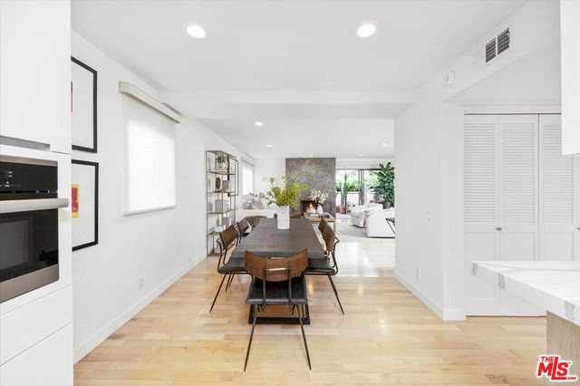 a view of a dining room with furniture and a rug