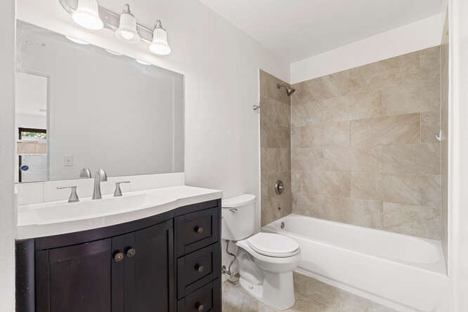 79-7199 Mamalahoa Highway, Unit 110 Holualoa, HI 96725 - Photo 14 of 26 a bathroom with a sink a toilet and shower