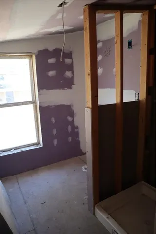 a view of an empty room and window