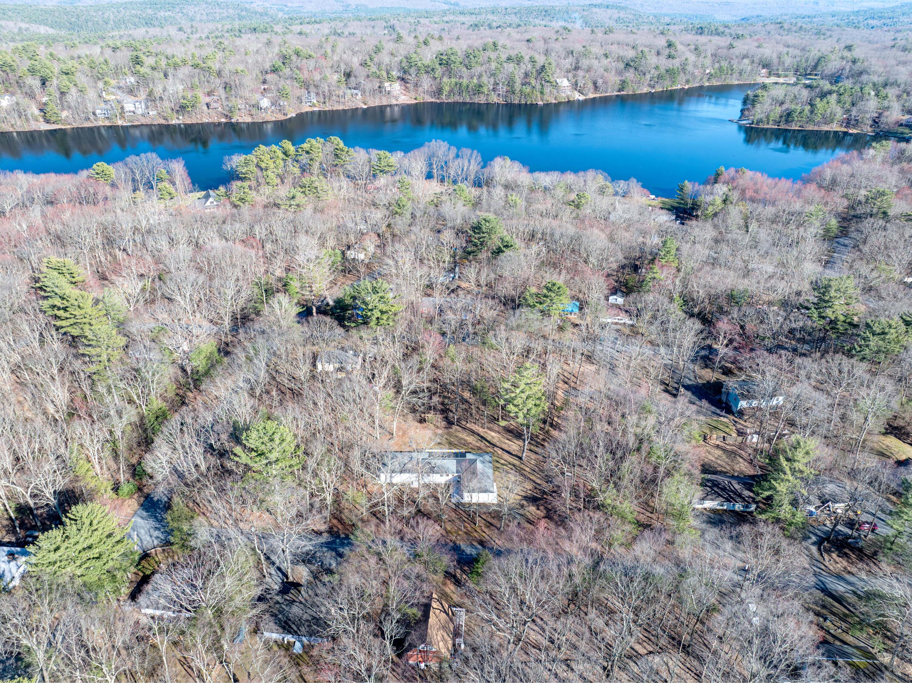 106 Dogwood Road Dingmans Ferry, PA 18328 - Photo 2 of 34 a view of a lake with beach