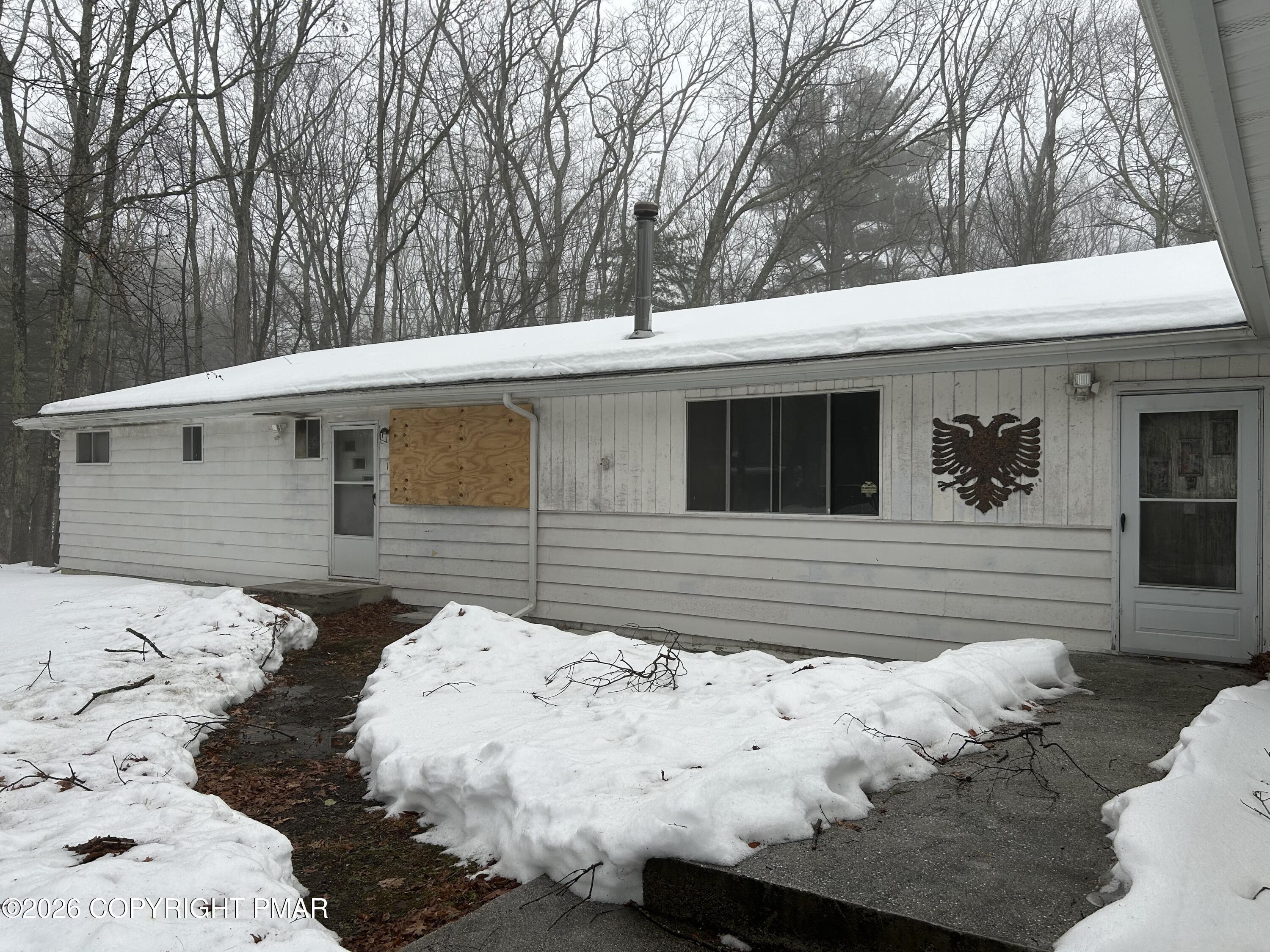 106 Dogwood Road Dingmans Ferry, PA 18328 - Photo 33 of 34 a side view of a house