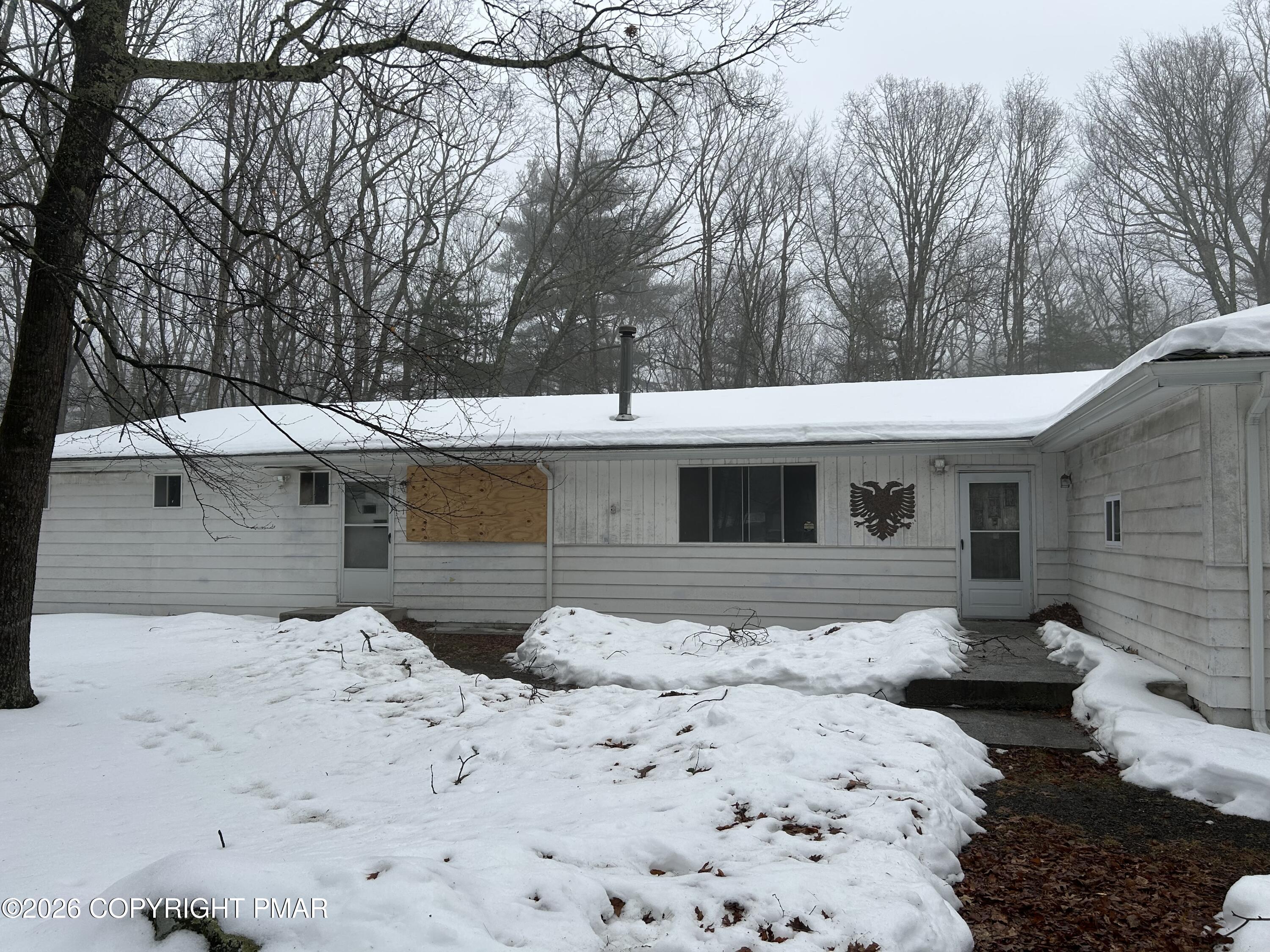 106 Dogwood Road Dingmans Ferry, PA 18328 - Photo 5 of 34 a front view of a house with yard