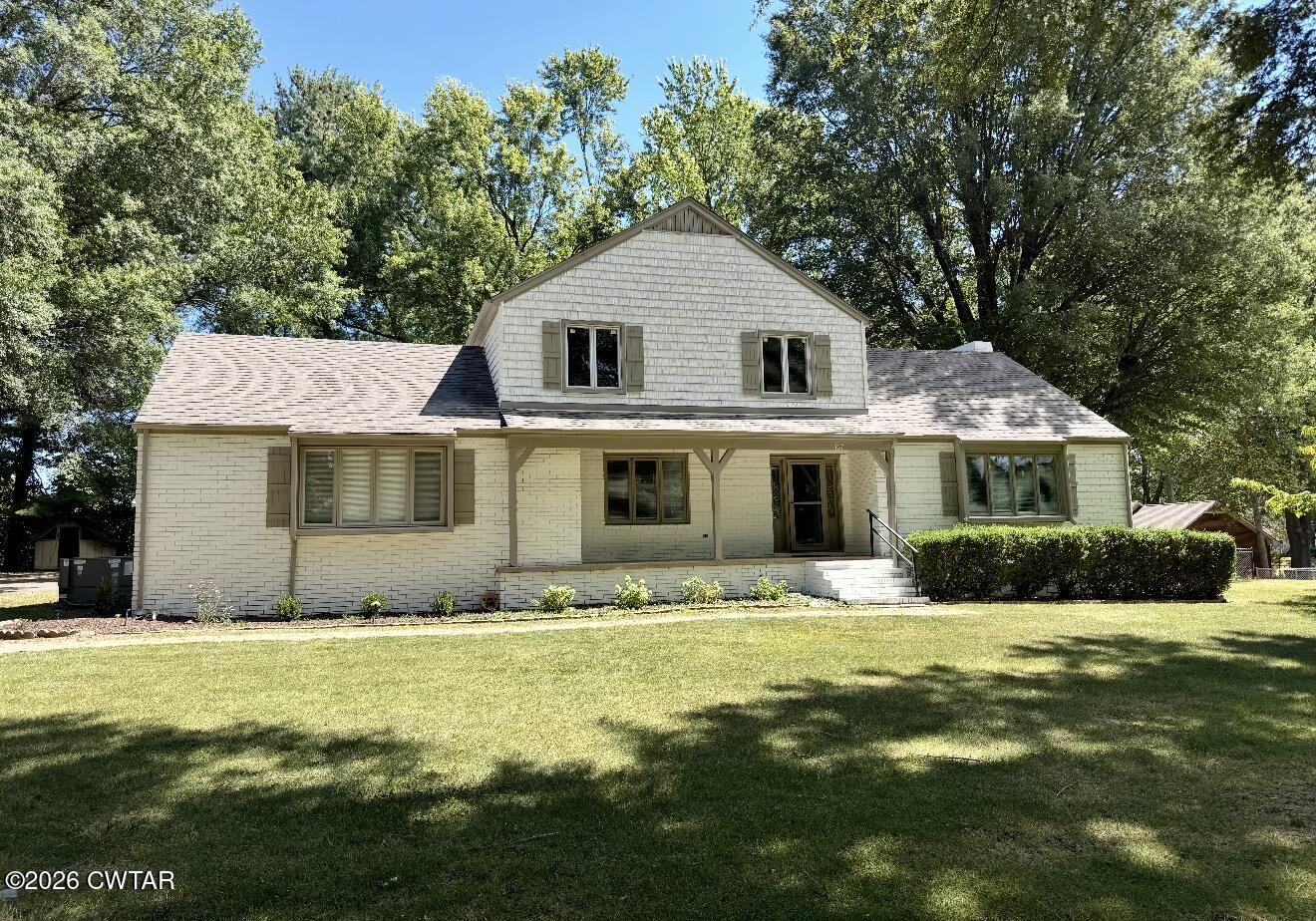 157 Mockingbird Lane Martin, TN 38237 - Photo 2 of 26 a front view of a house with a yard