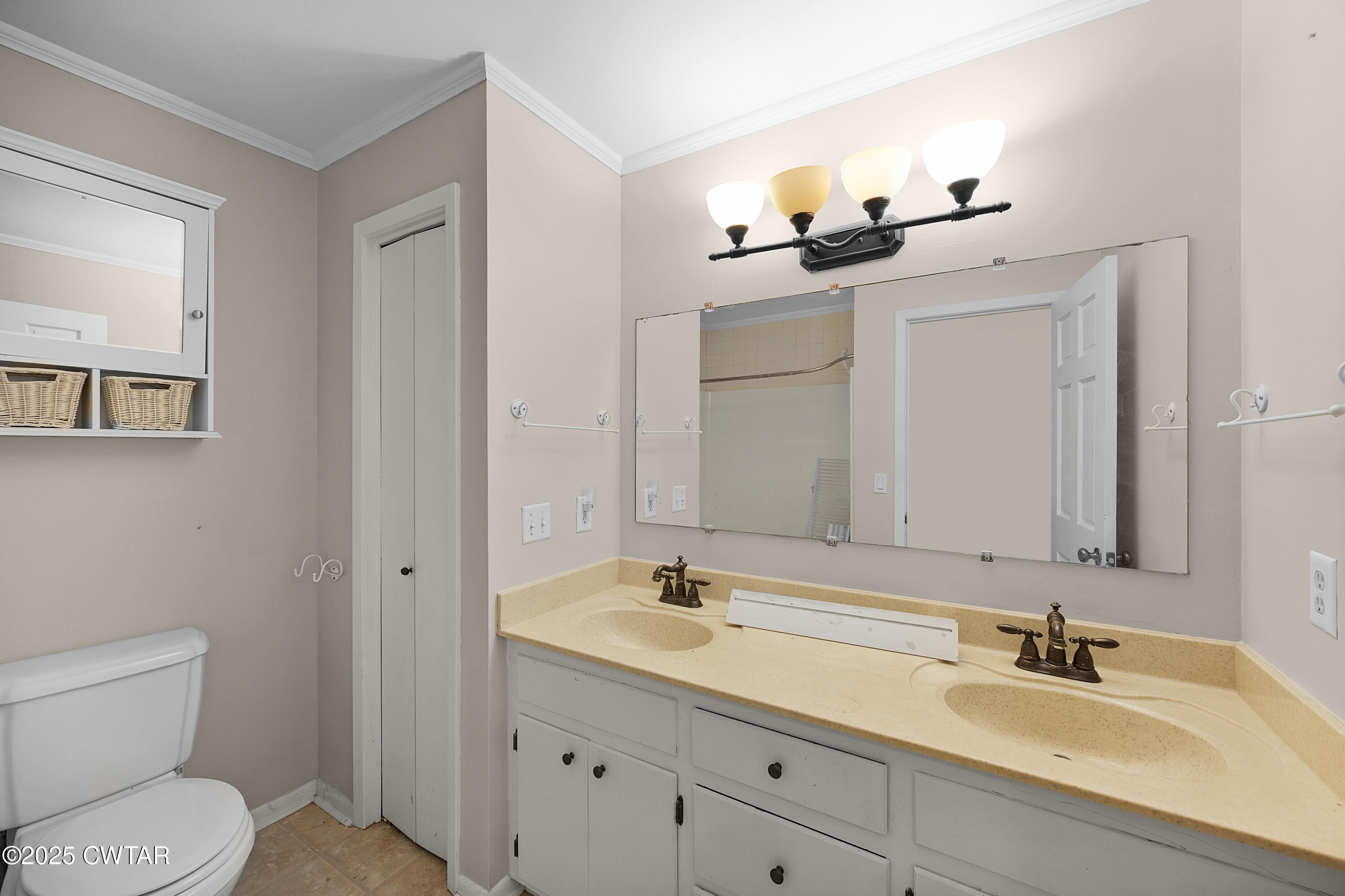 157 Mockingbird Lane Martin, TN 38237 - Photo 21 of 26 a bathroom with a toilet sink and mirror