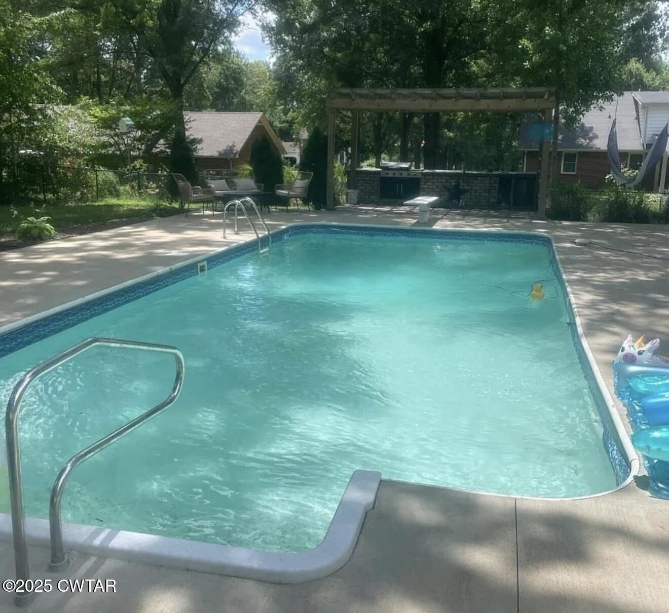 157 Mockingbird Lane Martin, TN 38237 - Photo 24 of 26 a view of a backyard with swimming pool